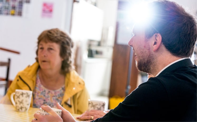 Man talking to woman